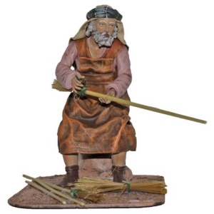 Pastor haciendo escobas