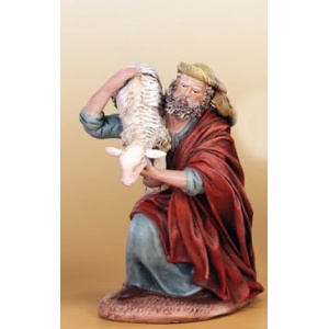 Pastor arrodillado con oveja en barro lienzado