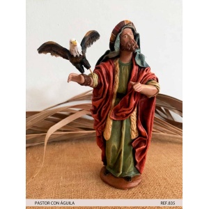 Pastor con águila en barro lienzado