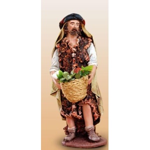 Pastor con cesto de frutas barro lienzado