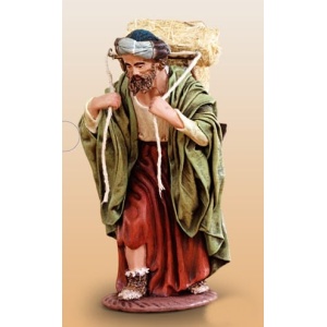 Pastor con balas de paja en la espalada