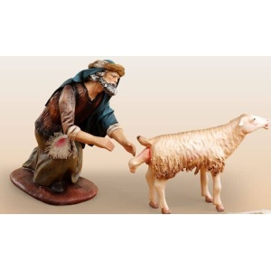 Pastor con oveja pariendo en barro lienzado