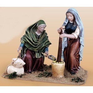 Pastoras picando trigo en barro lienzado