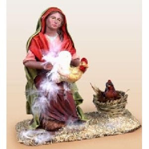 Pastora desplumando pollo en barro lienzado