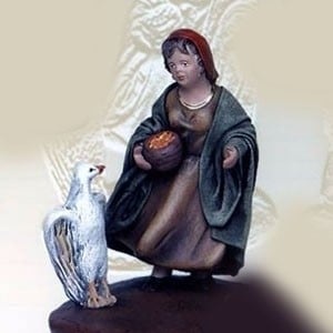 Niña con pájaro en barro lienzado