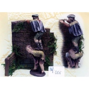 Niños saltando la pared en barro lienzado