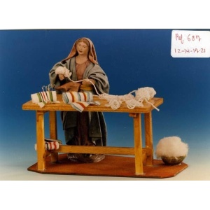 Pastora vendedora de telas en barro lienzado