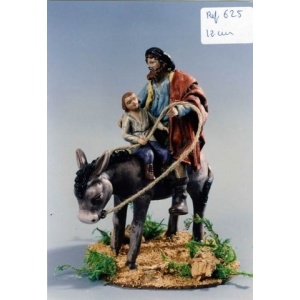 Pastor y niño en burra barro lienzado