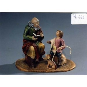 Pastor leyendo con niño en barro lienzado 14cm