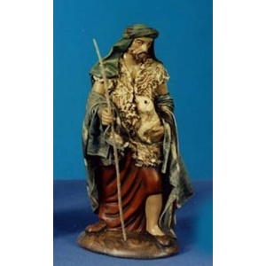 Pastor arrodillado ofrenda oveja