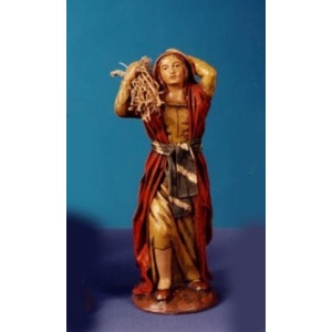 Pastora con fajo de leña en barro lienzado