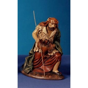 Pastor arrodillado ofrenda gallina