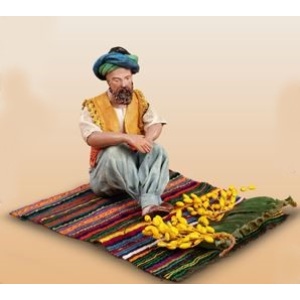 Pastor árabe sentado alfombra dátiles