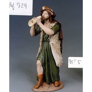 Pastor músico en barro lienzado