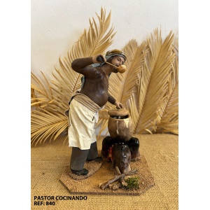 Pastor cocinando en barro lienzado