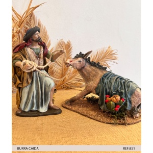 Pastor con burra caída en barro lienzado